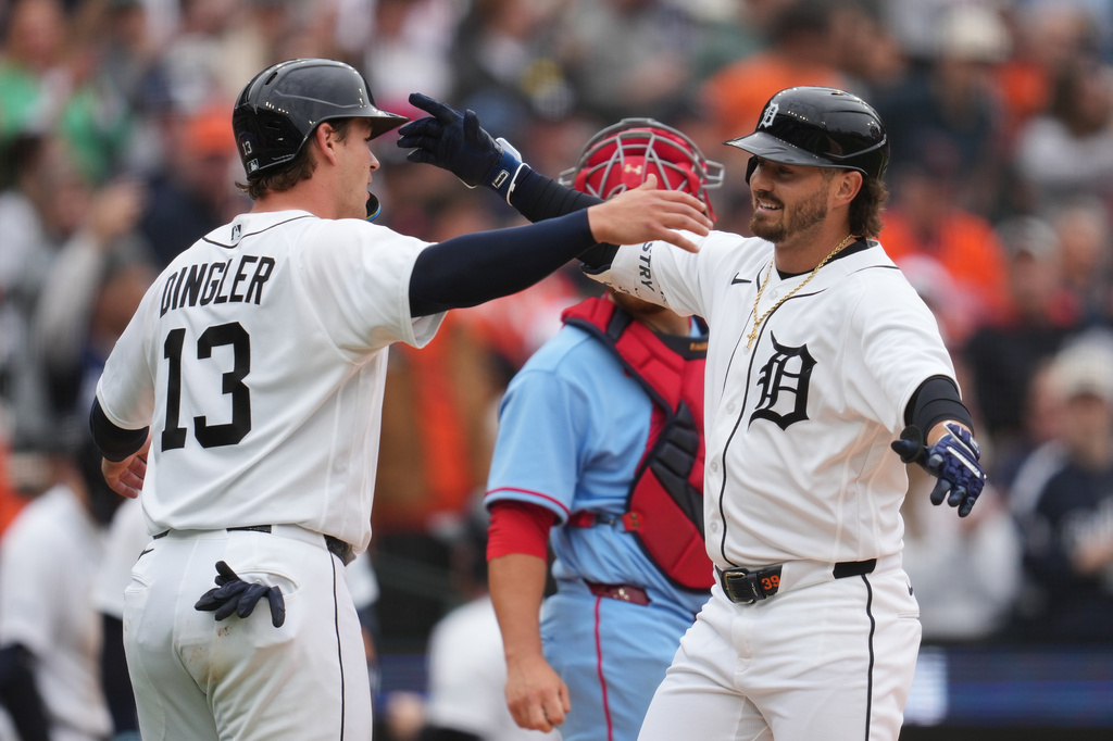 Detroit Tigers' Zach McKinstry, right, celebrates his two-run home run with Dillon Dingler (13) against the St. Louis Cardinals in the fourth inning of a baseball game Saturday, April 4, 2026, in Detroit. (AP Photo/Paul Sancya)