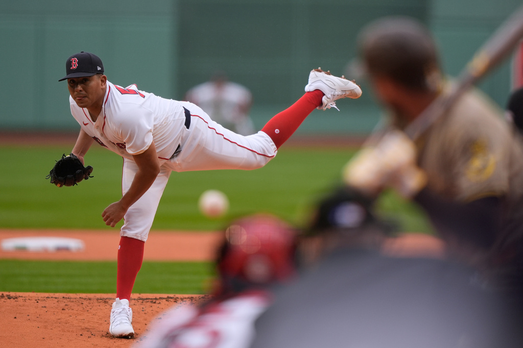 Boston Red Sox starting pitcher Ranger Suarez delivers a pitch in the first inning of a baseball game against the San Diego Padres, Sunday, April 5, 2026, in Boston. (AP Photo/Robert F. Bukaty)