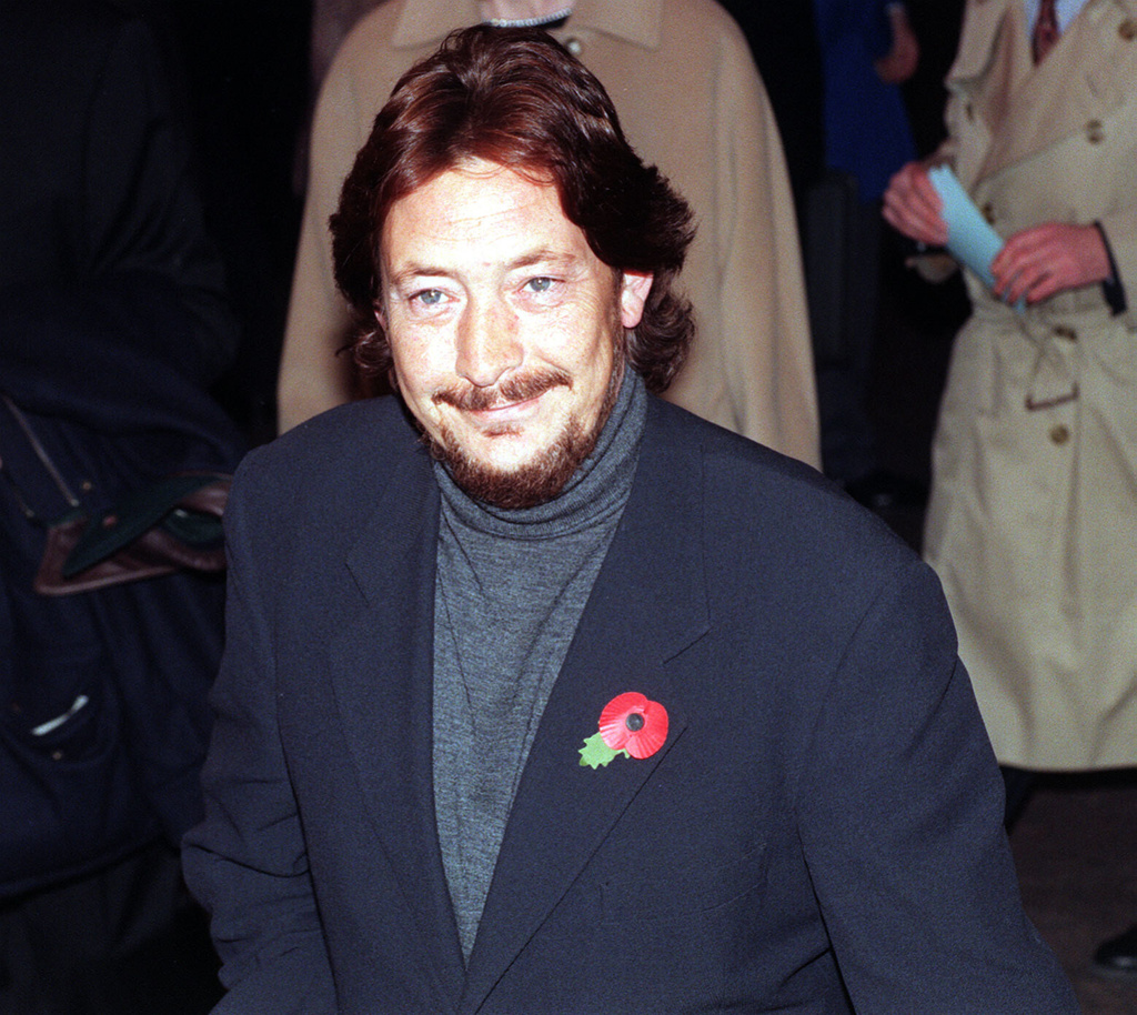 FILE - Chris Rea arrives at the Odeon Leicester Square for the opening of the London Film Festival, Nov. 7, 1996. (Michael Stephens/PA via AP, File)