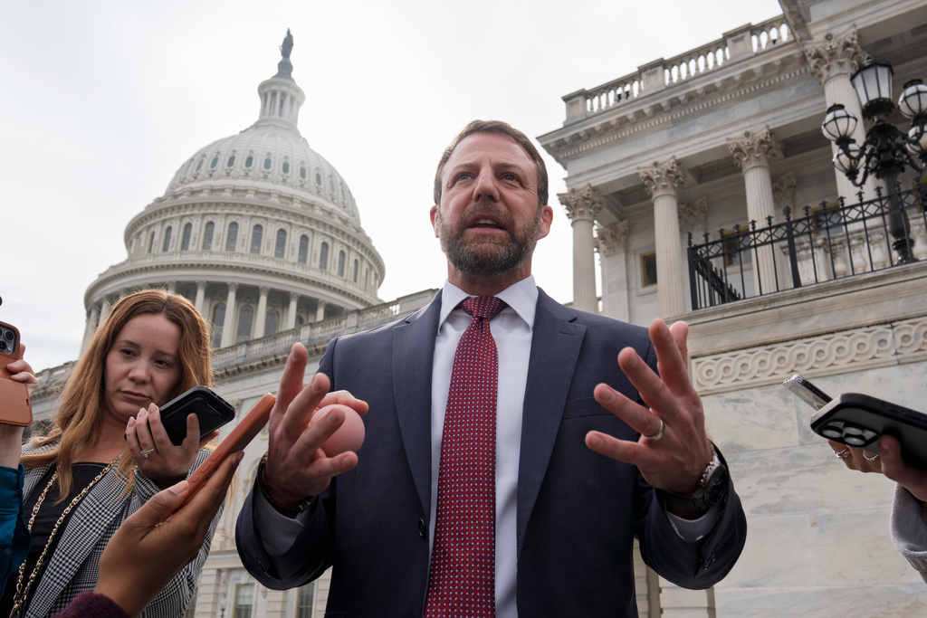 Sen. Markwayne Mullin, R-Okla., speaks with reporters on the steps at the Capitol in Washington, Thursday, March 5, 2026. (AP Photo/J. Scott Applewhite)