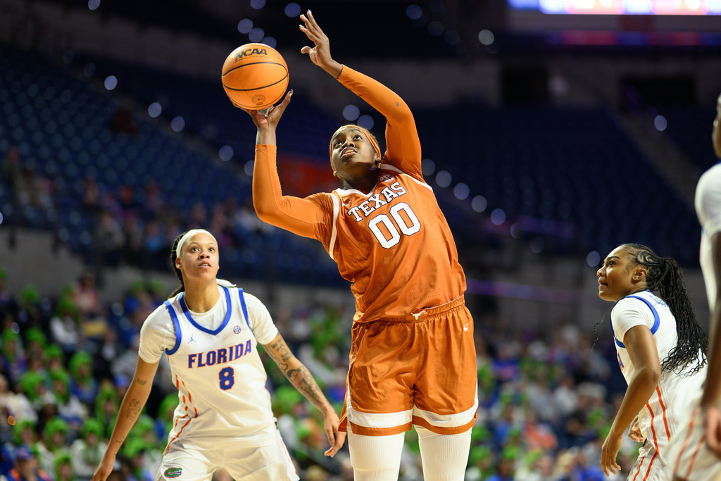 Texas center Kyla Oldacre (00) shoots during the first half of an NCAA college basketball game against Florida, Thursday, Jan. 29, 2026, in Gainesville, Fla. (AP Photo/Noah Lantor)