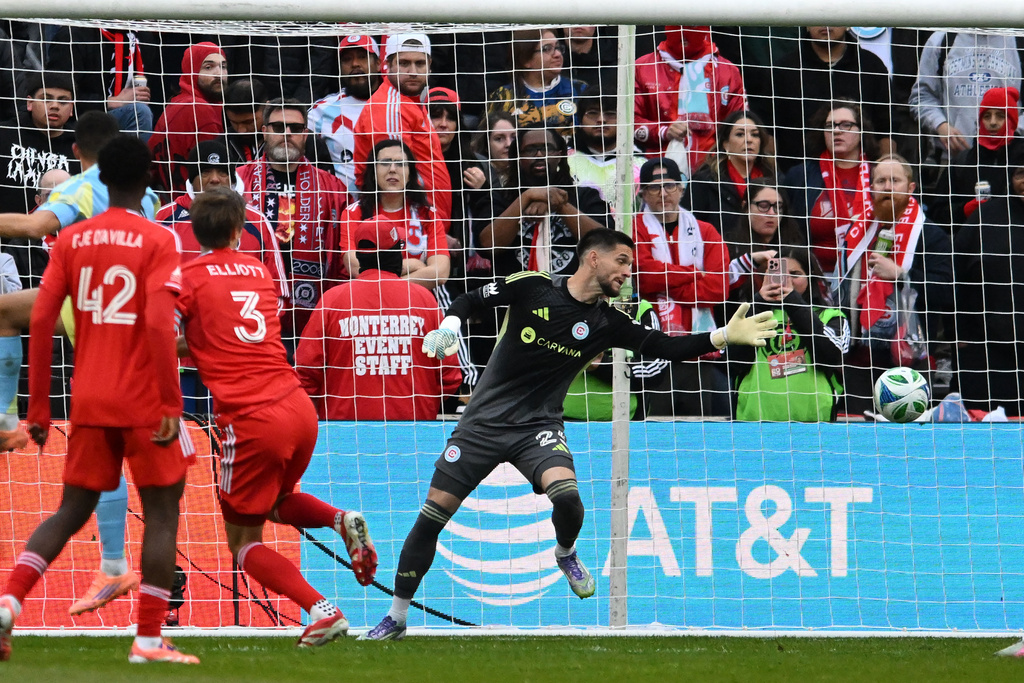 Chicago Fire goalie Jeffrey Gal (25) misses a goal scored by Philadelphia Union's Tai Baribo during the first half of an MLS soccer playoff match Saturday, Nov. 1, 2025, in Bridgeview, Ill. (AP Photo/Paul Beaty)