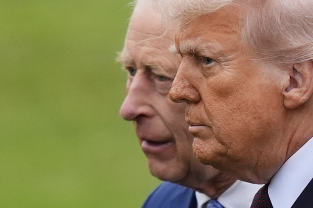 King Charles III, left, and President Donald Trump, left, during a Beating Retreat ceremony at Windsor Castle, England, Wednesday, Sept. 17, 2025. (Jordan Pettitt/Pool Photo via AP)