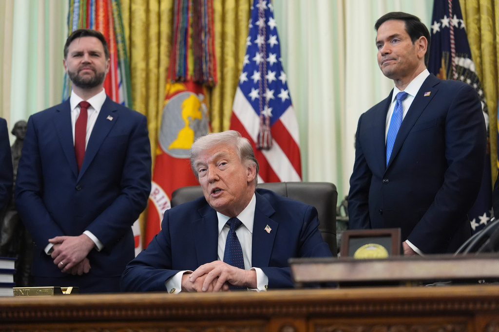 President Donald Trump speaks as Secretary of State Marco Rubio, right, and Vice President JD Vance listen in the Oval Office at the White House, Thursday, April 23, 2026, in Washington. (AP Photo/Mark Schiefelbein)