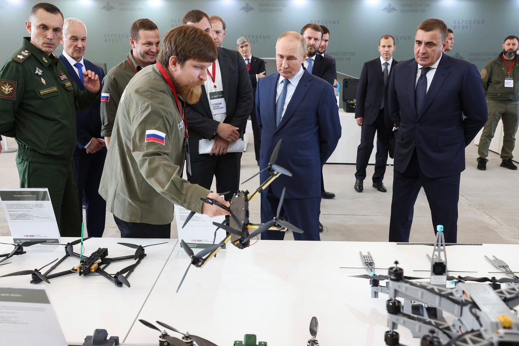 FILE - Russian President Vladimir Putin, center, speaks with Vladimir Tkachuk, front, the head of the Uraldronzavod, during his visit to the Special Technology Centre in St. Petersburg, Russia, Thursday, Sept. 19, 2024. (Valeriy Sharifulin, Sputnik, Kremlin Pool Photo via AP, File)