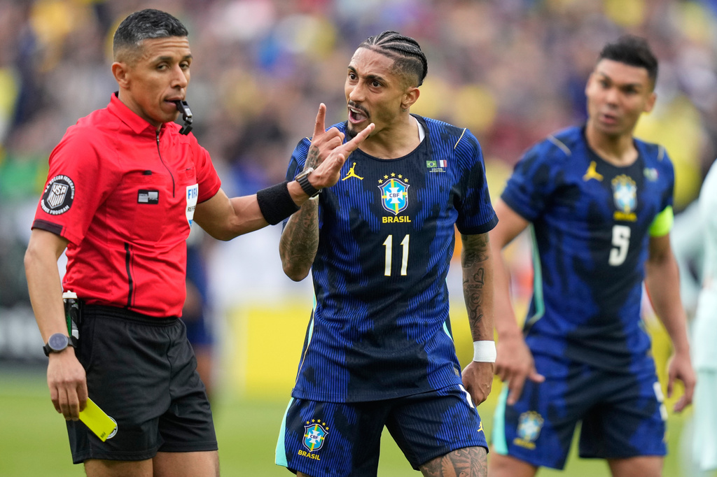 Brazil's Raphinha gestures at referee Guido Gonzales Jr. during the international friendly soccer match between Brazil and France in Foxborough, Mass, Thursday, March 26, 2026. (AP Photo/Charles Krupa)