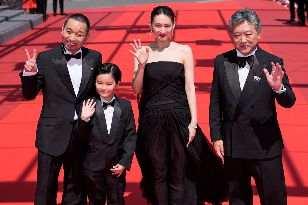 FILE - Daigo Yamamoto, from left, Rimu Kuwaki, Haruka Ayase, and director Hirokazu Kore-eda appear at the premiere of the film "Sheep in the Box" at the 79th international film festival, Cannes, southern France on May 16, 2026. (AP Photo/John Locher, File)