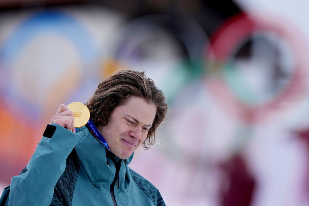 Brazil's Lucas Pinheiro Braathen is overcome by emotion as he holds his gold medal for an alpine ski, men's giant slalom race, at the 2026 Winter Olympics, in Bormio, Italy, Saturday, Feb. 14, 2026.(AP Photo/Julia Demaree Nikhinson)