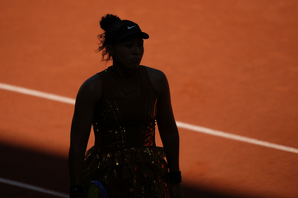 Naomi Osaka of Japan reacts as she plays against Laura Siegemund of Germany during their first round women's singles tennis match at the French Open tennis tournament in Paris, Tuesday, May 26, 2026. (AP Photo/Aurelien Morissard)