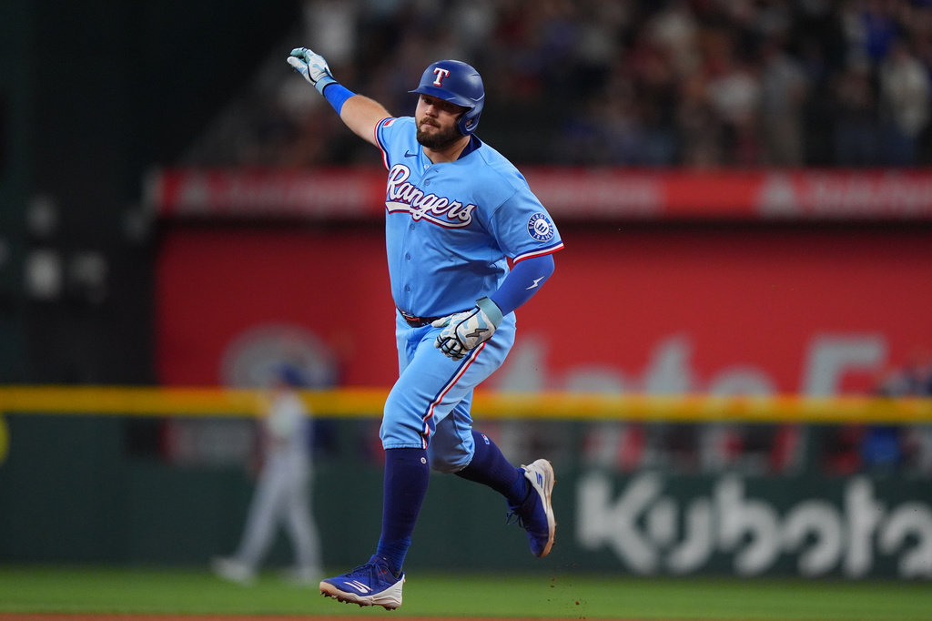 Texas Rangers' Jake Burger runs the bases after hitting a home run during the fourth inning of a baseball game against the Toronto Blue Jays, Sunday, Sept. 20, 2026, in Arlington, Texas. (AP Photo/LM Otero)