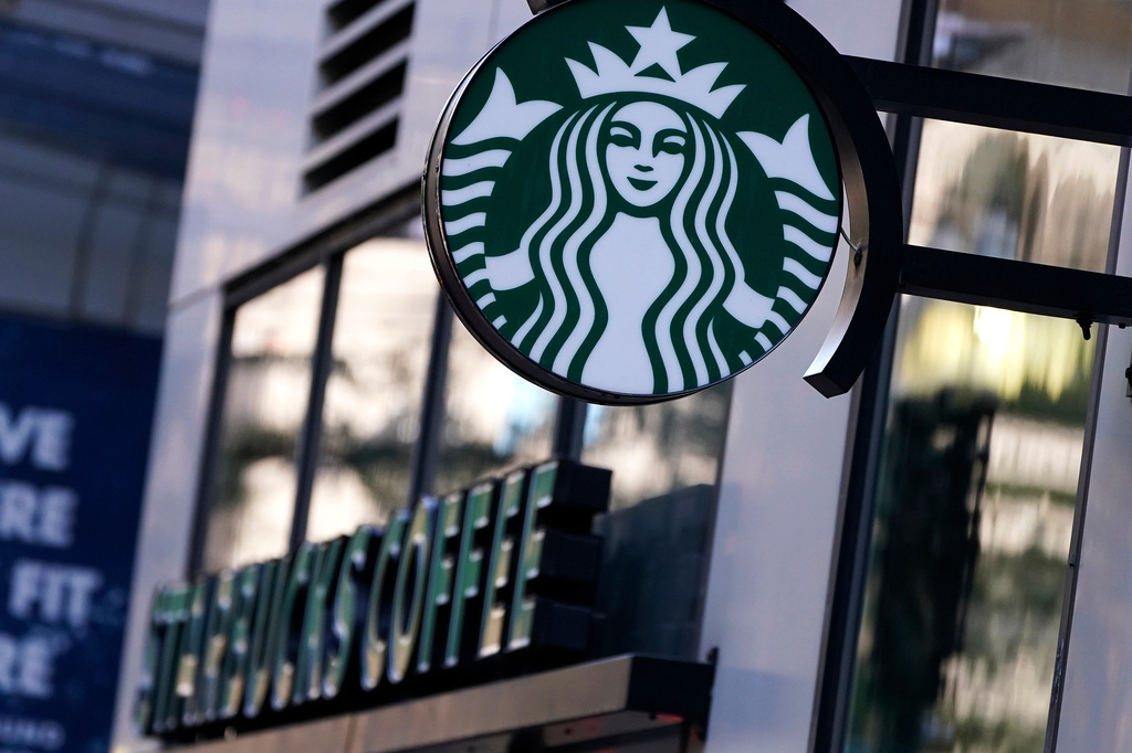 FILE - The "Siren" logo hangs outside a Starbucks Coffee shop, Wednesday, July 14, 2021, in Boston. (AP Photo/Charles Krupa, File)
