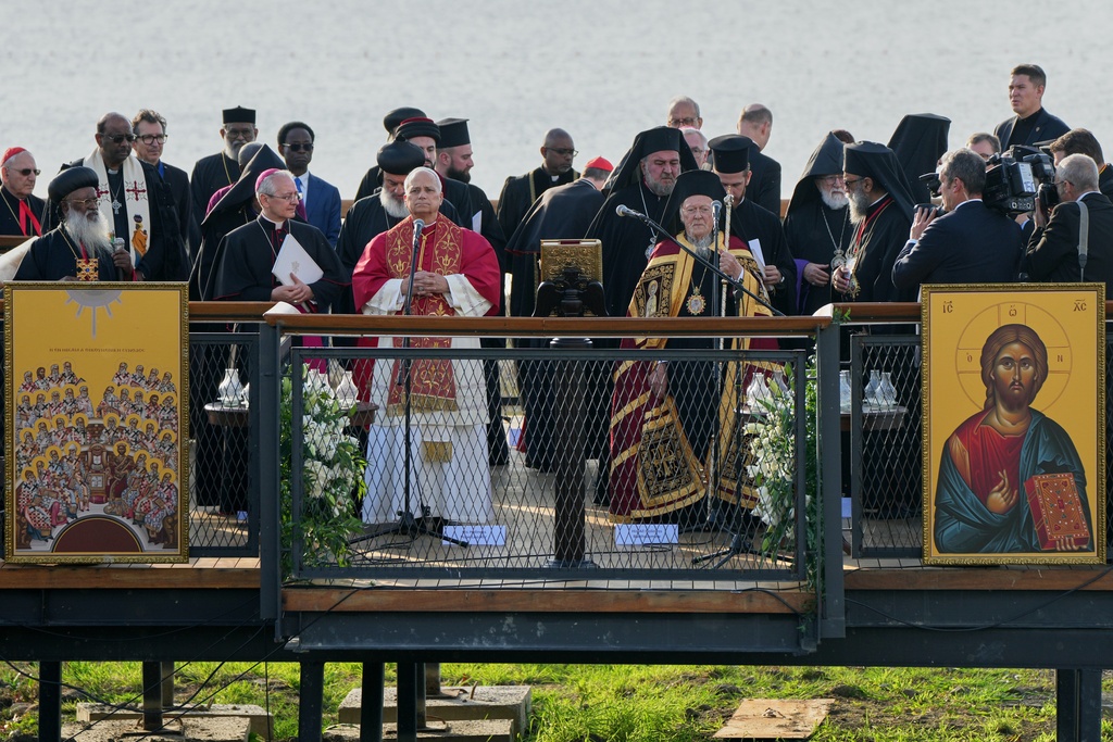 Pope Leo XIV and the Ecumenical Patriarch Bartholomew I lead an Ecumenical prayer service near the archaeological excavations of the ancient Basilica of Saint Neophytos, in Iznik, Turkey, Friday, Nov. 28, 2025. (AP Photo/Domenico Stinellis)