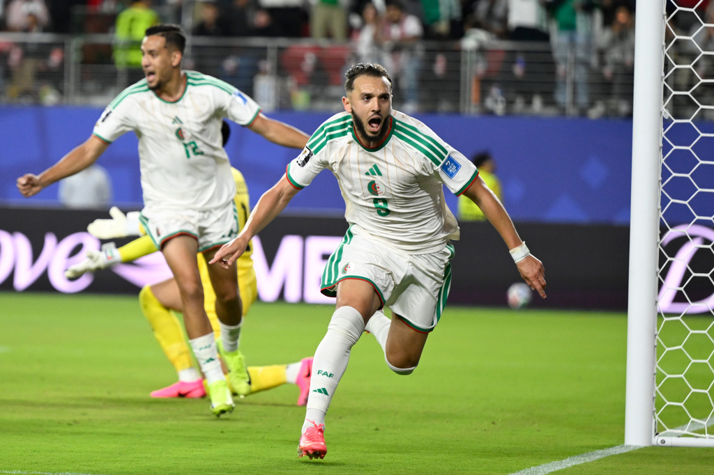 Algeria's Amine Gouiri, front, celebrates after scoring his side's second goal against Jordan during the World Cup Group J soccer match in Santa Clara, Calif., near San Francisco, Monday, June 22, 2026. (AP Photo/Eakin Howard)