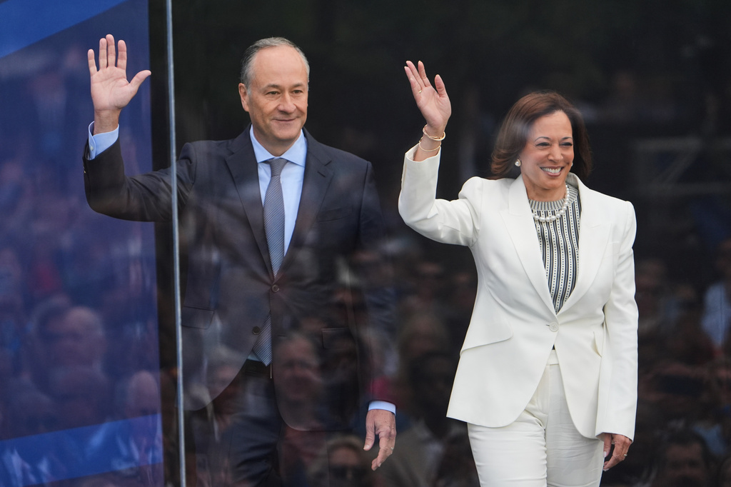 FILE - Former Vice President Kamala Harris and her husband Doug Emhoff arrive on stage during the dedication ceremony for the Obama Presidential Center, on June 18, 2026, in Chicago. (AP Photo/Jeff Roberson, File)