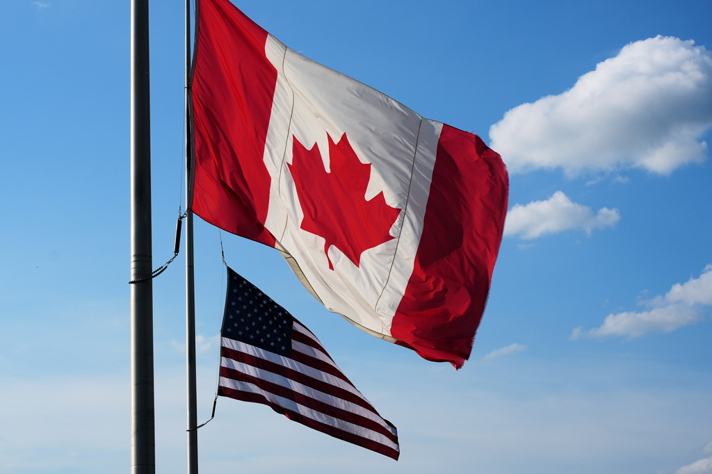 The national flags of Canada, front, and the United States fly outside the Galleria Mall in Buffalo, New York, Wednesday, Aug. 26, 2026. (AP Photo/Gene J. Puskar)