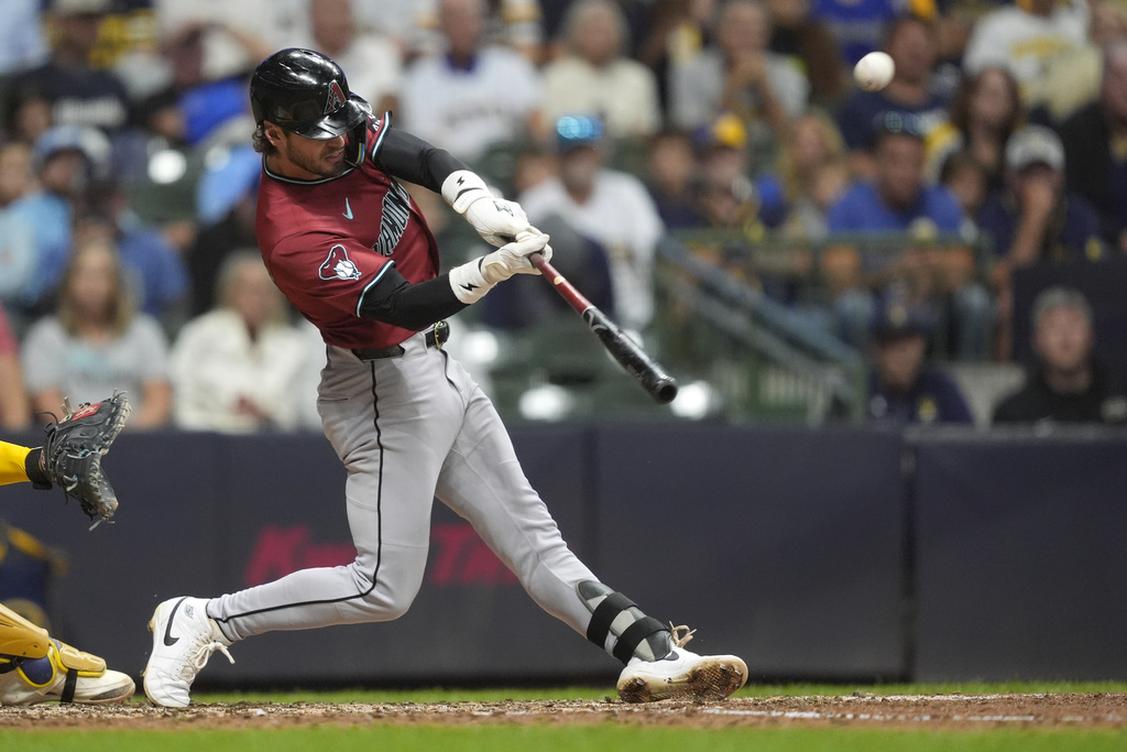 Arizona Diamondbacks' Blaze Alexander hits a two-run home run during the sixth inning of a baseball game against the Milwaukee Brewers, Wednesday, Aug. 27, 2025, in Milwaukee. (AP Photo/Aaron Gash)