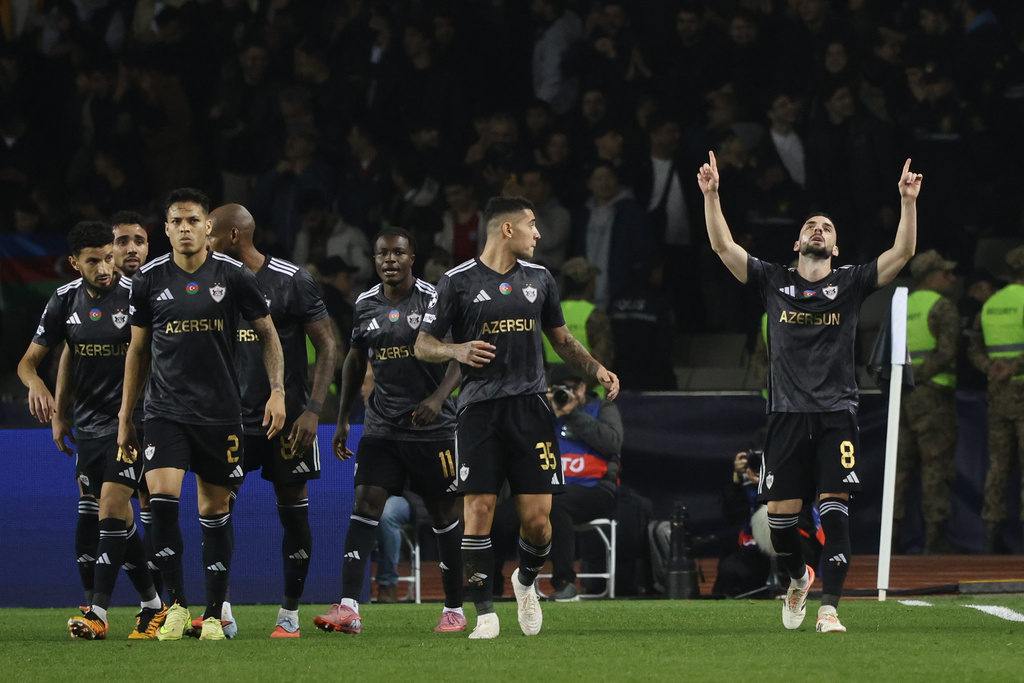 Qarabag's players celebrate their side's second goal scored by Qarabag's Marko Jankovic, right, from a penalty spot during the Champions League opening phase soccer match between Qarabag and Chelsea in Baku, Azerbaijan, Wednesday, Nov. 5, 2025. (AP Photo)