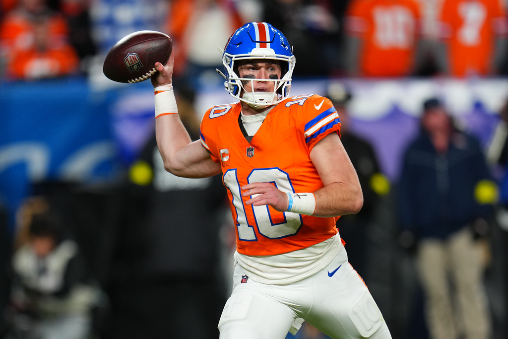 Denver Broncos quarterback Bo Nix (10) throws during the second half of an NFL football game against the Las Vegas Raiders Thursday, Nov. 6, 2025, in Denver. (AP Photo/Jack Dempsey)