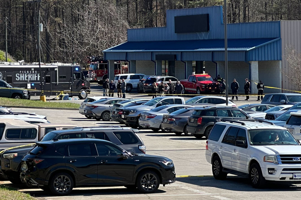 Emergency vehicles are seen outside a Department of Veterans Affairs clinic in Jasper, Ga., Tuesday, March 17, 2026. (AP Photo/Emilie Megnien)