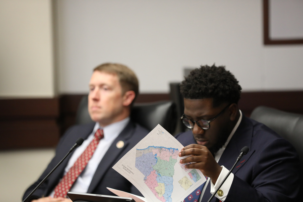 South Carolina Democratic Rep. Keishan Scott looks at a proposed U.S. House district map during a redistricting hearing in a state House Judiciary subcommittee on Tuesday, May, 12 2026, in Columbia, S.C. (AP Photo/Jeffrey Collins)