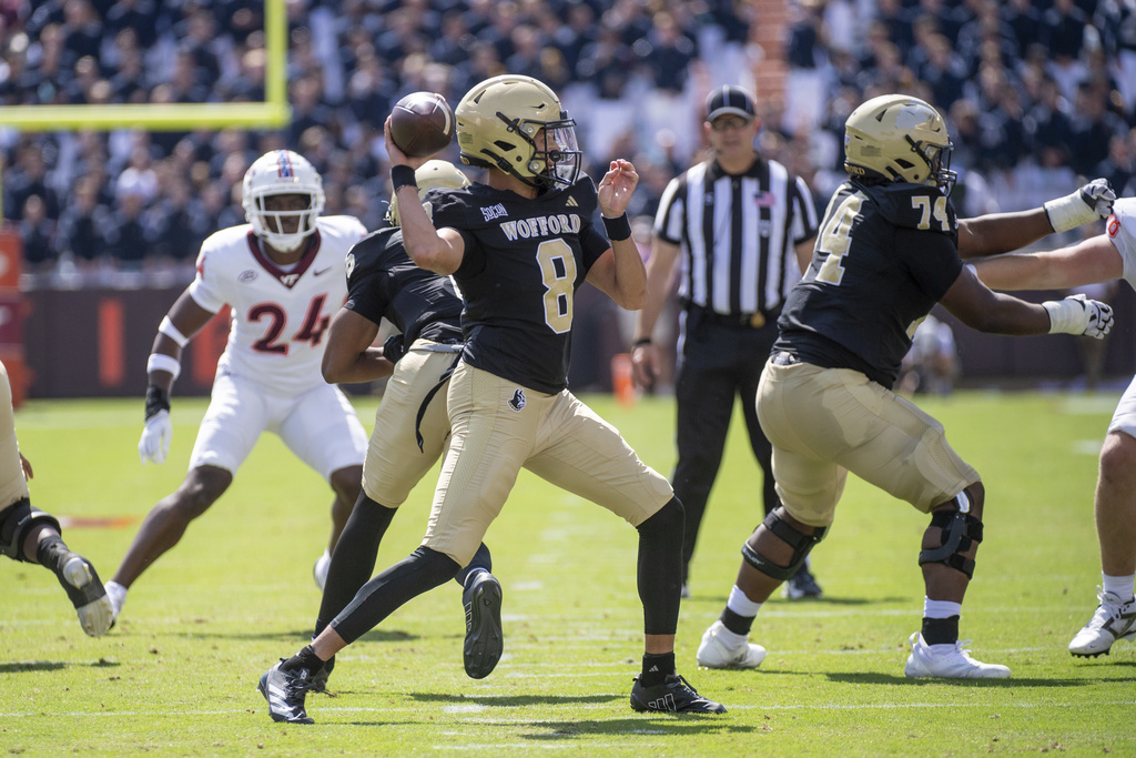 Wofford quarterback Jayden Whitaker (8) throws a pass during the first half of an NCAA college football game against Virginia Tech, Saturday, Sept. 20 2025, in Blacksburg, Va. (AP Photo/Robert Simmons)