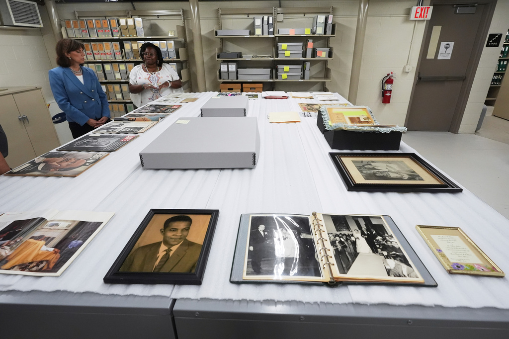 FILE - The Henry Ford President and CEO Patricia Mooradian, left, and Amber N. Mitchell, Curator of Black History view items from the Jackson House at The Henry Ford in Dearborn, Mich., July 14, 2025. (AP Photo/Paul Sancya, File)