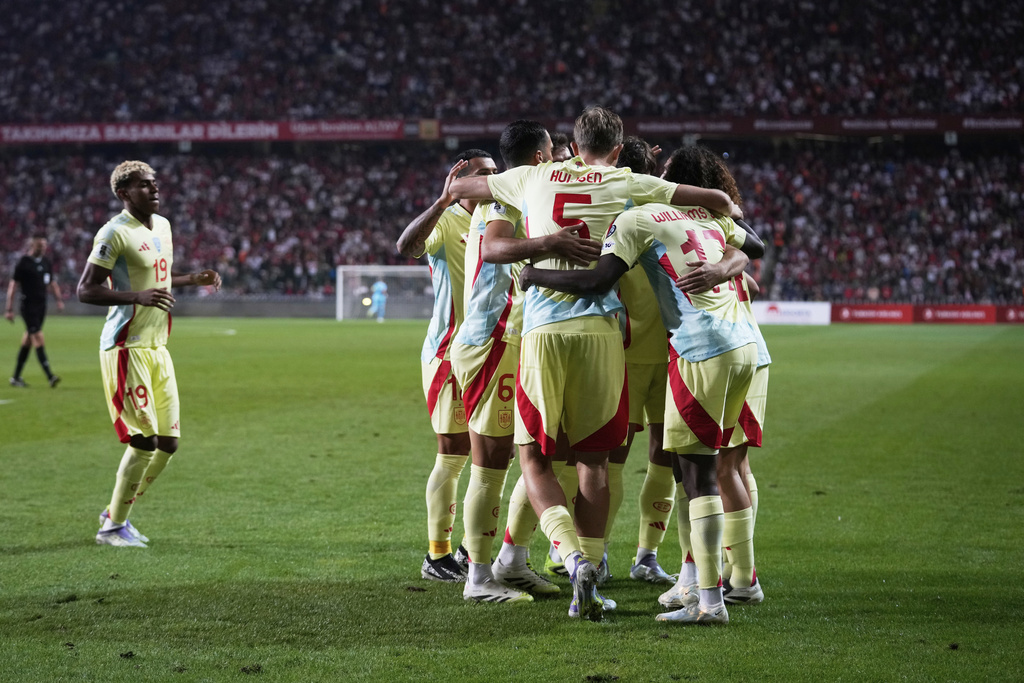 Spain players celebrate the opening goal scoring by Pedri during a World Cup qualifying round Group E soccer match between Turkey and Spain at Konya Buyuksehir stadium, in Konya, Turkey, Sunday, Sept. 7, 2025. (AP Photo/Khalil Hamra)