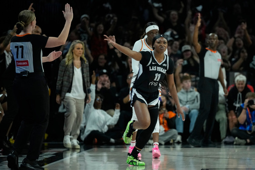 Las Vegas Aces guard Dana Evans (11) celebrates a three pointer against the Phoenix Mercury during the first half in Game 1 of a WNBA basketball final playoff series Friday, Oct. 3, 2025, in Las Vegas. (AP Photo/John Locher) Las Vegas Aces guard Dana Evans (11) celebrates a three pointer against the Phoenix Mercury during the first half in Game 1 of a WNBA basketball final playoff series Friday, Oct. 3, 2025, in Las Vegas. (AP Photo/John Locher)
