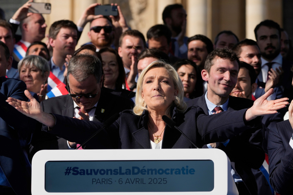 FILE - French far-right leader Marine Le Pen delivers her speech during the French far-right party national rally near the parliament in Paris, Sunday, April 6, 2025. (AP Photo/Michel Euler, File)