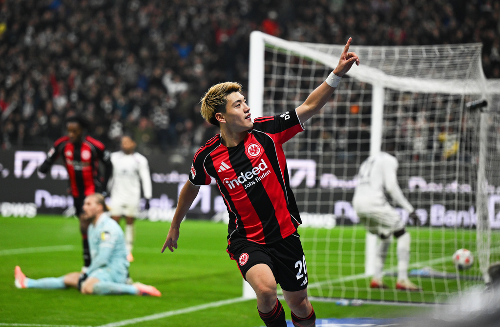 Frankfurt's Ritsu Doan celebrates after scoring during the German Bundesliga soccer match between Eintracht Frankfurt and FSV Mainz 05 in Frankfurt, Germany, Sunday, Nov. 9, 2025. (Arne Dedert/dpa via AP)