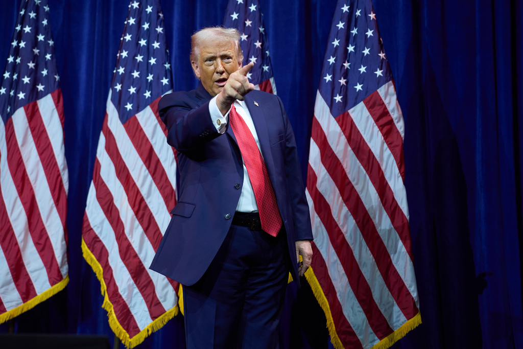President Donald Trump points to the crowd as he walks off stage after speaking to House Republican lawmakers during their annual policy retreat, Tuesday, Jan. 6, 2026, in Washington. (AP Photo/Evan Vucci)