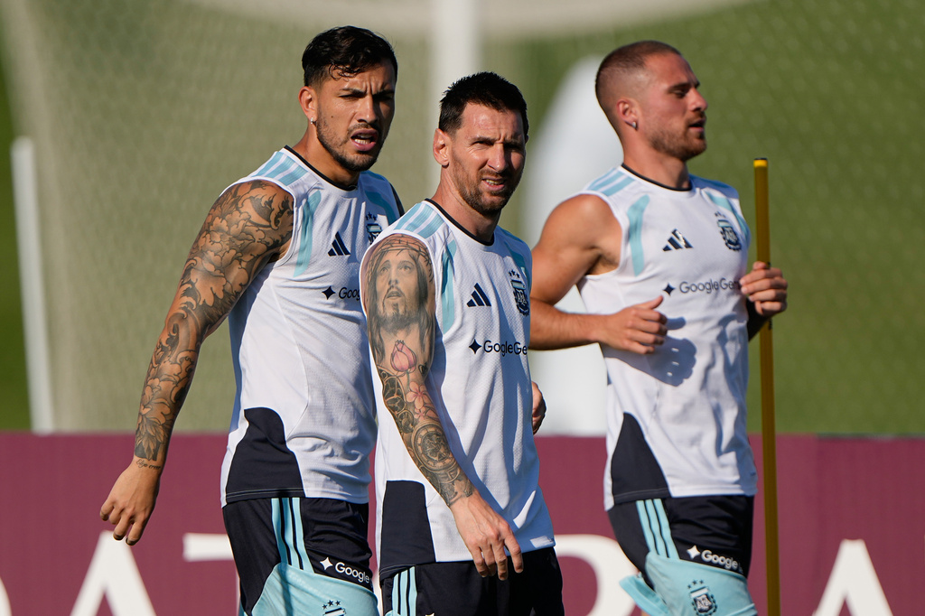 Argentina's Leandro Paredes, left, Lionel Messi, center, and Alexis Mac Allister train for the World Cup soccer tournament Wednesday, June 24, 2026, in Kansas City, Kan. (AP Photo/Charlie Riedel)