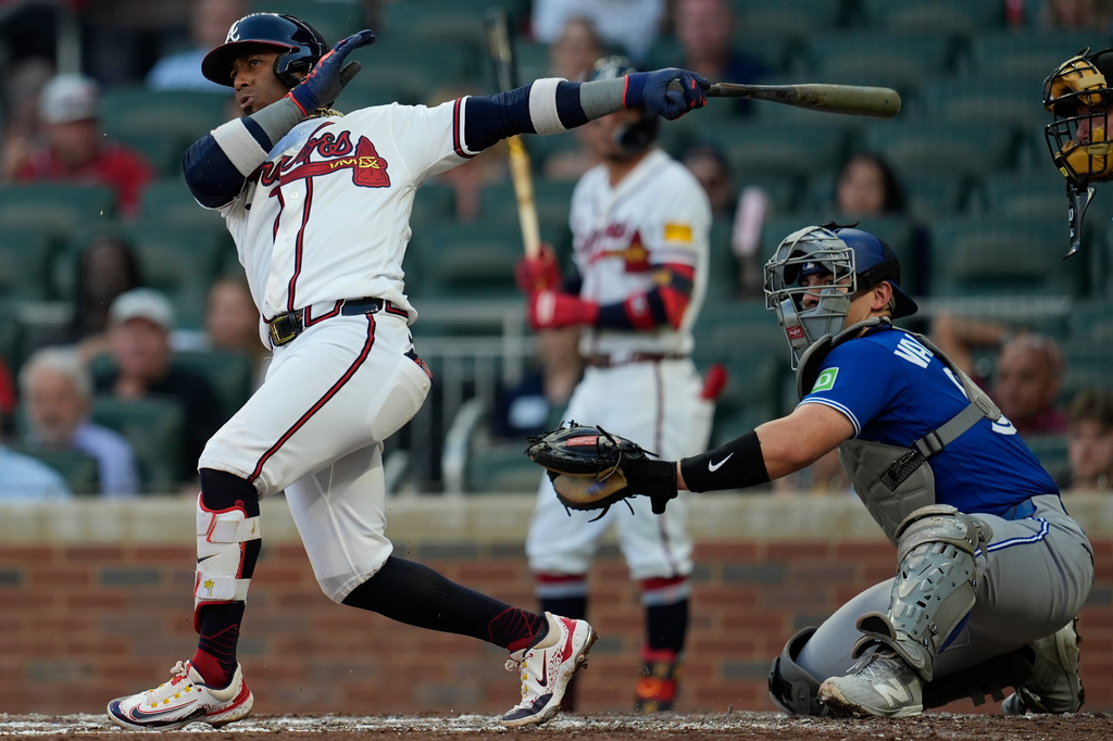 Atlanta Braves' Ozzie Albies (1) hits a double in the third inning of a baseball game against the Toronto Blue Jays, Wednesday, June 3, 2026, in Atlanta. (AP Photo/Mike Stewart)