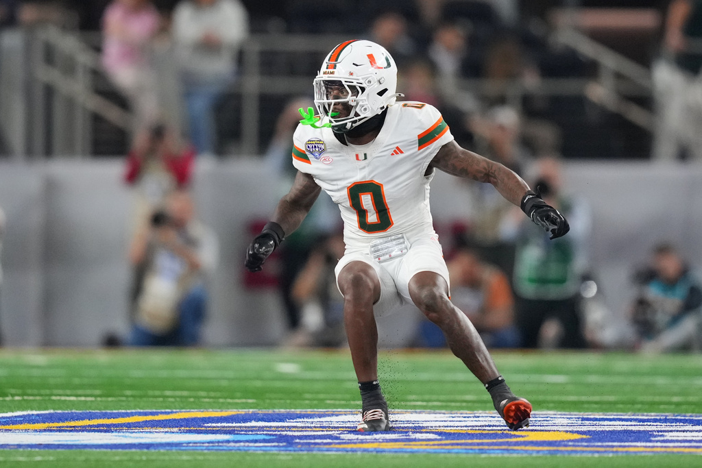 Miami defensive back Keionte Scott drops back to defend against Ohio State during the second half of the Cotton Bowl College Football Playoff quarterfinal game Wednesday, Dec. 31, 2025, in Arlington, Texas. (AP Photo/Julio Cortez)