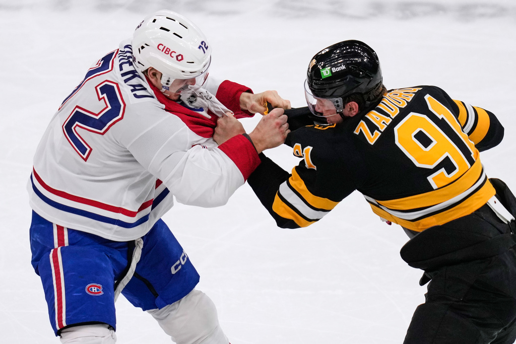 Montreal Canadiens defenseman Arber Xhekaj (72) fights Boston Bruins defenseman Nikita Zadorov (91) during the first period of an NHL hockey game, Tuesday, Dec. 23, 2025, in Boston. (AP Photo/Charles Krupa)