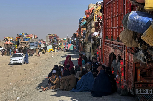 Afghan refugees sit beside trucks loaded with their belongings as they wait their turn to leave for their homeland through a border crossing point which partially opens following Oct.19 ceasefire on the outskirts of Chaman, a border town on the Pakistan Afghan border, Wednesday, Oct. 29, 2025. (AP Photo/H. Achakzai) Afghan refugees sit beside trucks loaded with their belongings as they wait their turn to leave for their homeland through a border crossing point which partially opens following Oct.19 ceasefire on the outskirts of Chaman, a border town on the Pakistan Afghan border, Wednesday, Oct. 29, 2025. (AP Photo/H. Achakzai)