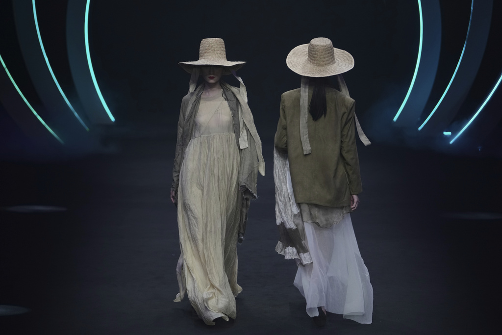 Models present a Dongfang Cup 2024 China Womenswear Design Competition Excellent Works by local designers during the SS2026 China Fashion Week, in Beijing, Monday, Sept. 8, 2025. (AP Photo/Andy Wong)