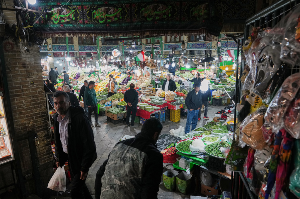 People shop at Tajrish bazaar in Tehran, Iran, Monday, April 6, 2026. (AP Photo/Francisco Seco)