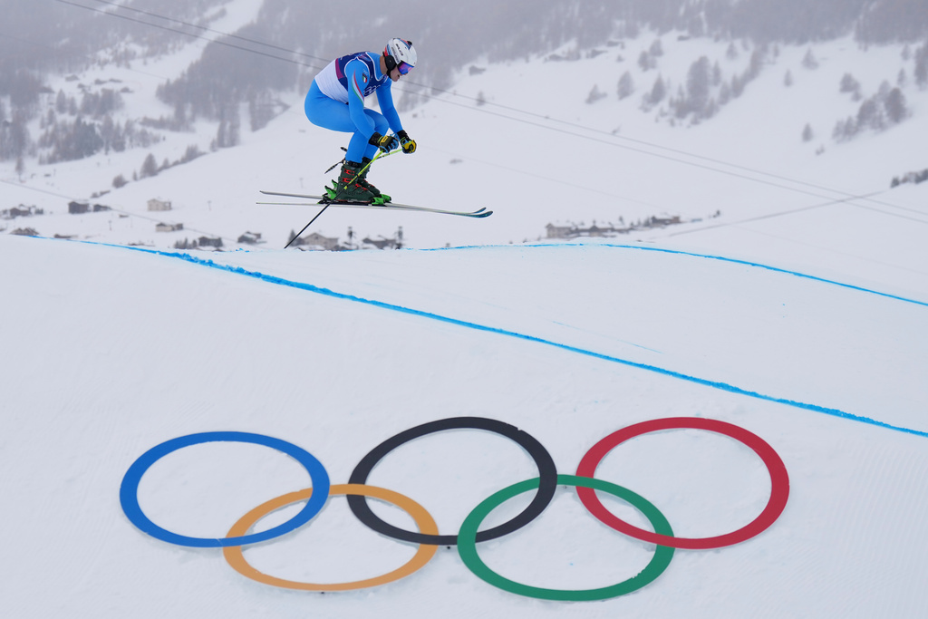 Italy's Simone Deromedis (15) competes during the men's ski cross qualifying at the 2026 Winter Olympics, in Livigno, Italy, Saturday, Feb. 21, 2026. (AP Photo/Abbie Parr)
