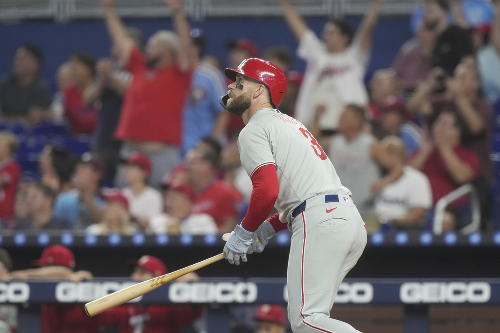 Philadelphia Phillies' Bryce Harper (3) hits a home run during the first inning of a baseball game against the Miami Marlins Saturday, Sept. 6, 2025, in Miami. (AP Photo/Marta Lavandier)