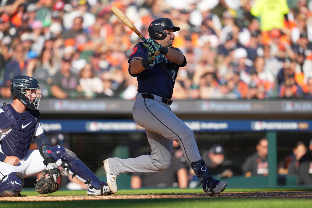 Seattle Mariners' Cal Raleigh follows through on an RBI single during the fifth inning in Game 4 of baseball's American League Division Series against the Detroit Tigers Wednesday, Oct. 8, 2025, in Detroit. (AP Photo/Paul Sancya)