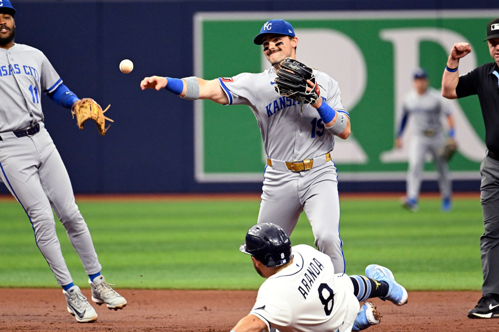 Tampa Bay Rays' Jonathan Aranda (8) is out at second as Kansas City Royals second baseman Michael Massey (19) turns a double play during the first inning of a baseball game, Monday, June 22, 2026, in St. Petersburg, Fla. (AP Photo/Jason Behnken)