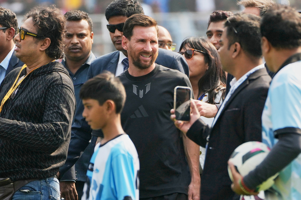 Argentine soccer star Lionel Messi, center, arrives at the Salt Lake Stadium, in Kolkata, India, Saturday, Dec. 13, 2025. (AP Photo/Bikas Das)