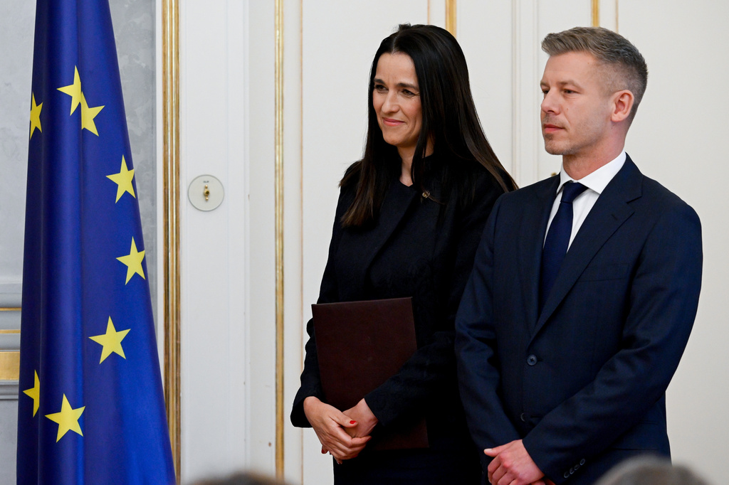 Prime Minister Peter Magyar, right, and Foreign Minister Anita Orban during the appointment ceremony of ministers of the Tisza government at the presidential Alexander Palace in Budapest, Hungary, Tuesday, May 12, 2026. (Szilard Koszticsak/MTI via AP)