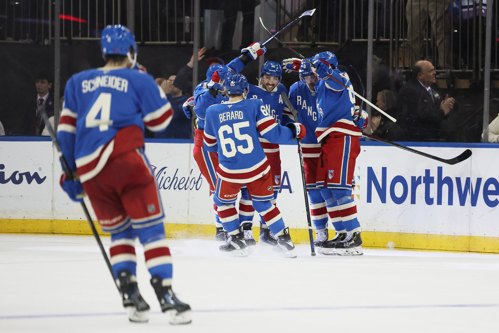 The New York Rangers celebrate their win in overtime during an NHL hockey game against the Montréal Canadiens, Saturday, Dec. 13, 2025, in New York. (AP Photo/Heather Khalifa)