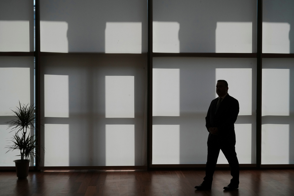 A member of the security detail is silhouetted during the NATO summit in Ankara, Turkey, Wednesday, July 8, 2026. (AP Photo/Alastair Grant, Pool)