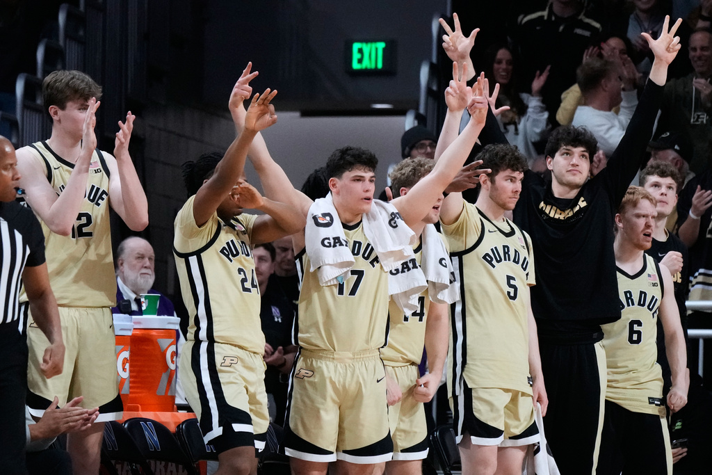 Purdue players celebrate after guard C.J. Cox scored a three-point basket during the second half of an NCAA college basketball game against Northwestern in Evanston, Ill., Wednesday, March 4, 2026. (AP Photo/Nam Y. Huh)