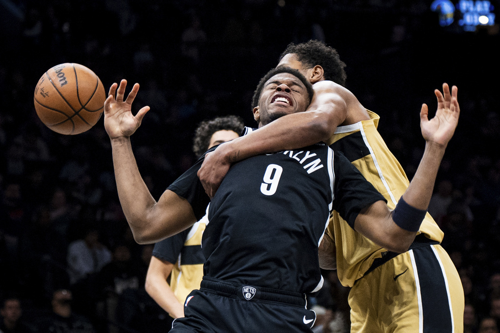 Brooklyn Nets forward E.J. Liddell (9) is fouled by Washington Wizards forward Julian "Juju" Reese (15) during the first half of an NBA basketball game, Sunday, April 5, 2026, in New York. (AP Photo/Angelina Katsanis)