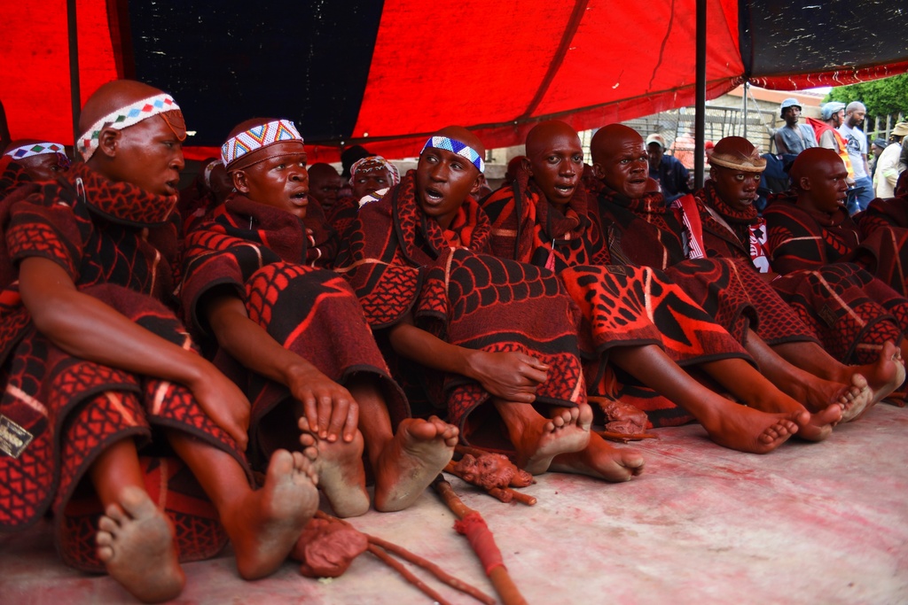 A group of young initiates sit during an initiation ceremony in Phuthaditjhaba, South Africa, Saturday, Jan. 3, 2026. (AP Photo/Alfonso Nqunjana)