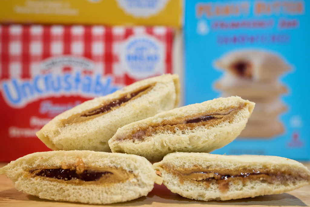 Crust-less sandwiches from Smucker's and Trader Joe's are displayed, Wednesday, Oct. 15, 2025, in Detroit. (AP Photo/Ryan Sun)